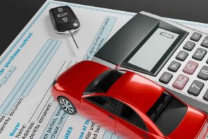 macchina grande rossa, calcolatrice, chiavi auto