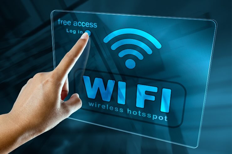 scritta wifi e simbolo wifi con dito che indica